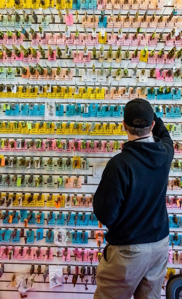 A man shopping in our showroom looking at a wall of key blanks.